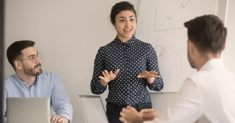 A group of people in a meeting room.