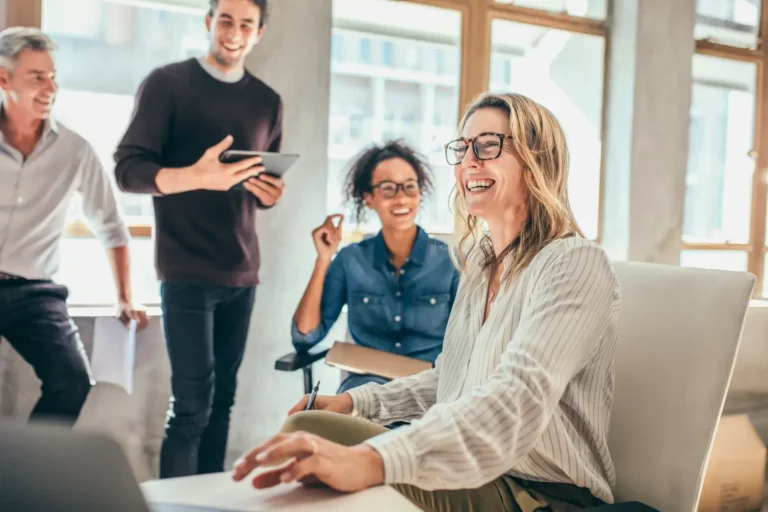 A group of people working together in an office.