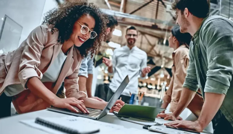 A group of people working together in an office.